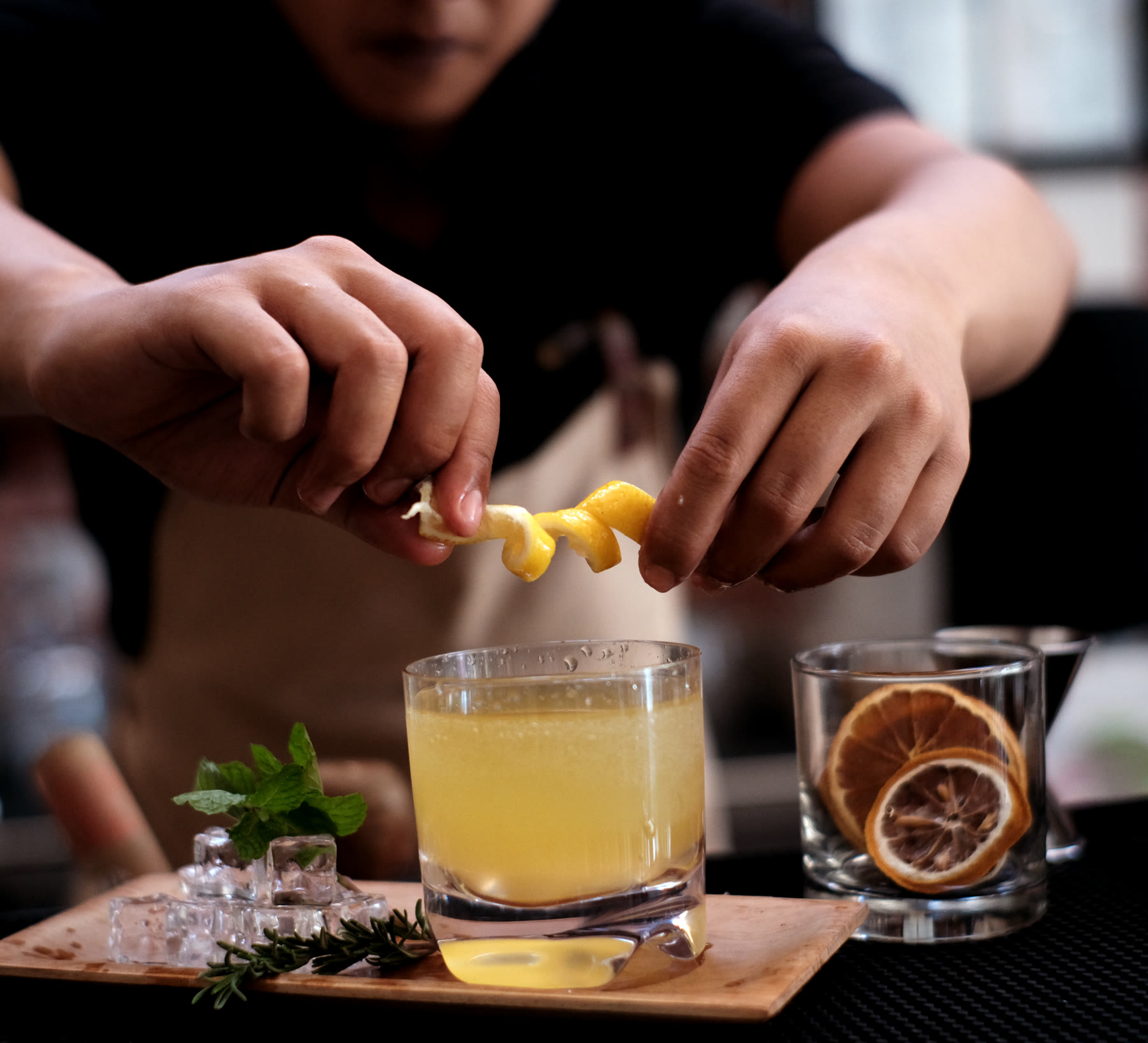 A cocktail being garnished at the bar