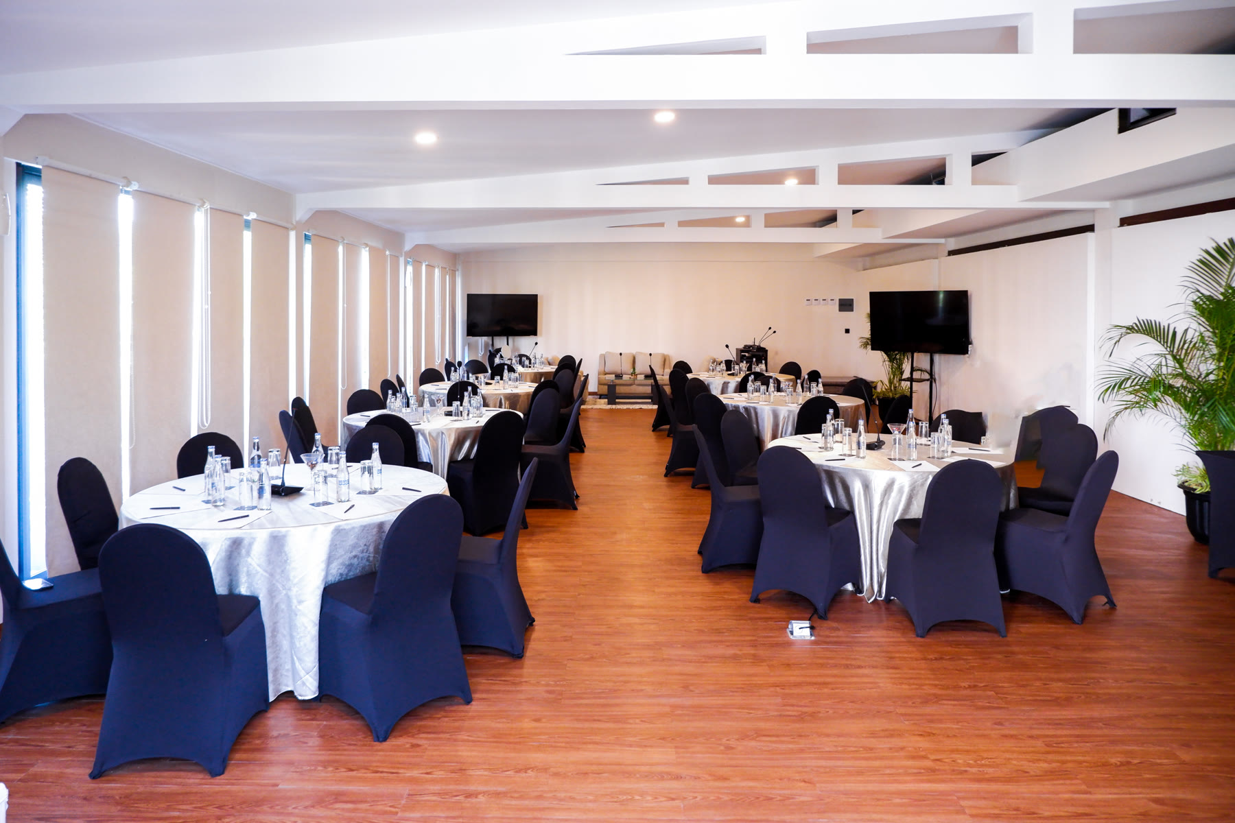 A function room set with round tables