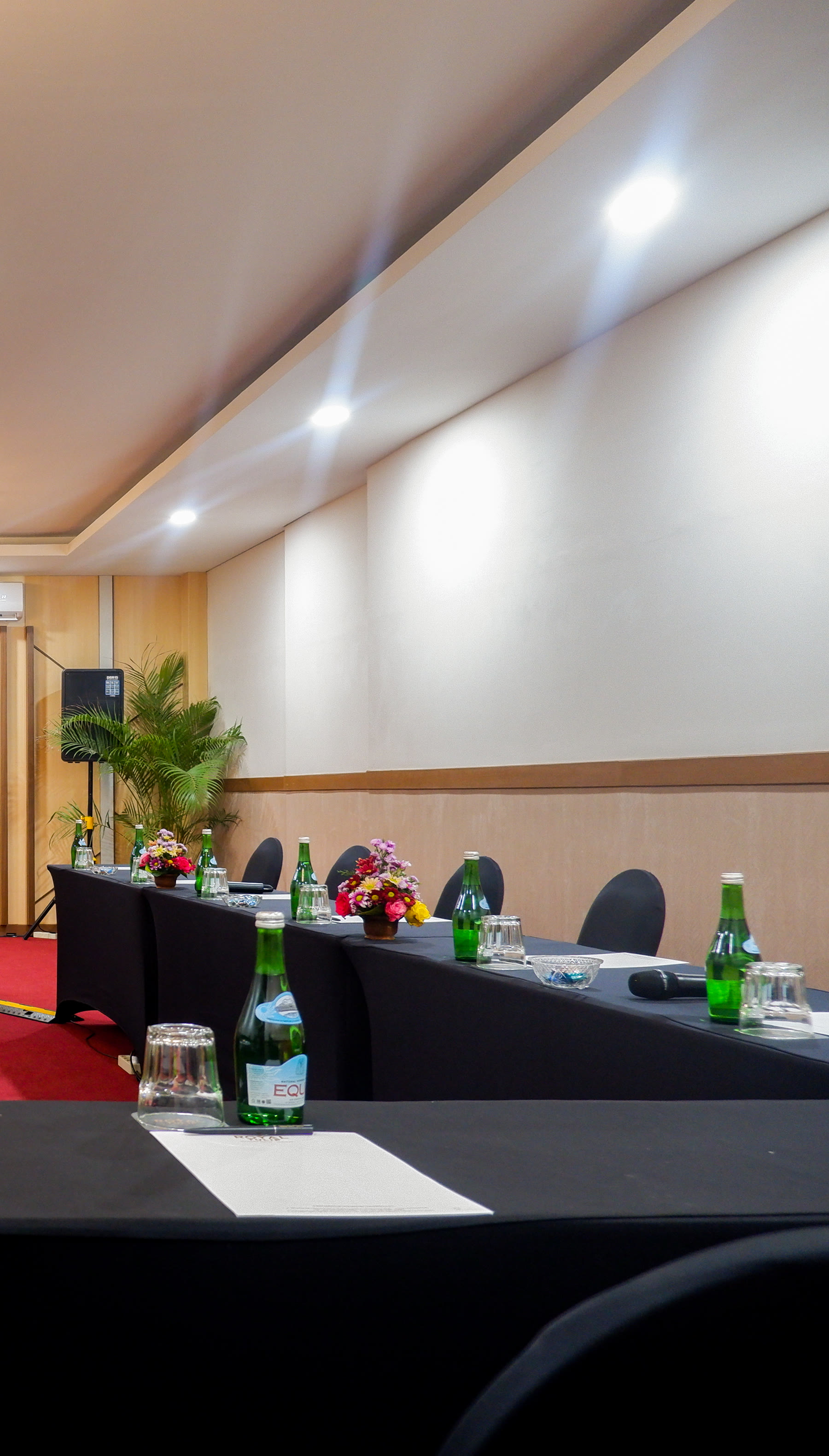 A meeting room set with long tables