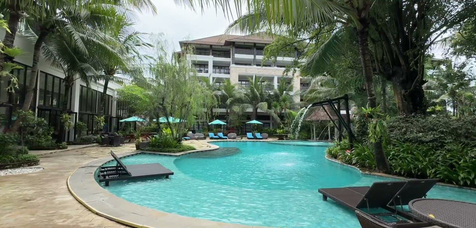 The hotel building above the resort pool